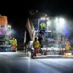 Night-Time-Highway-Resurfacing-Project-with-Heavy-Machinery-scaled sm